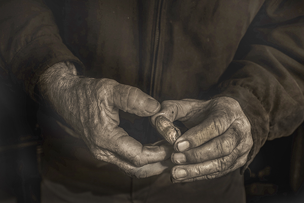 getting a lesson in how to open a hot boiled peanut